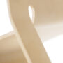 Close-up detail of Eco chair beech wood grain and laminated construction showing Peter Karpf design quality