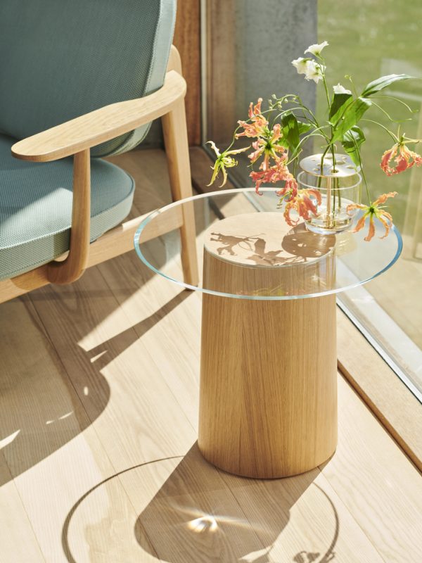 An elegant side table by Danish architect Mette Schelde integrates wood
