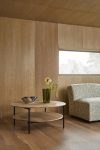 Mio occasional table by Takagi Homstvedt featuring circular oak top and lapped steel framework design