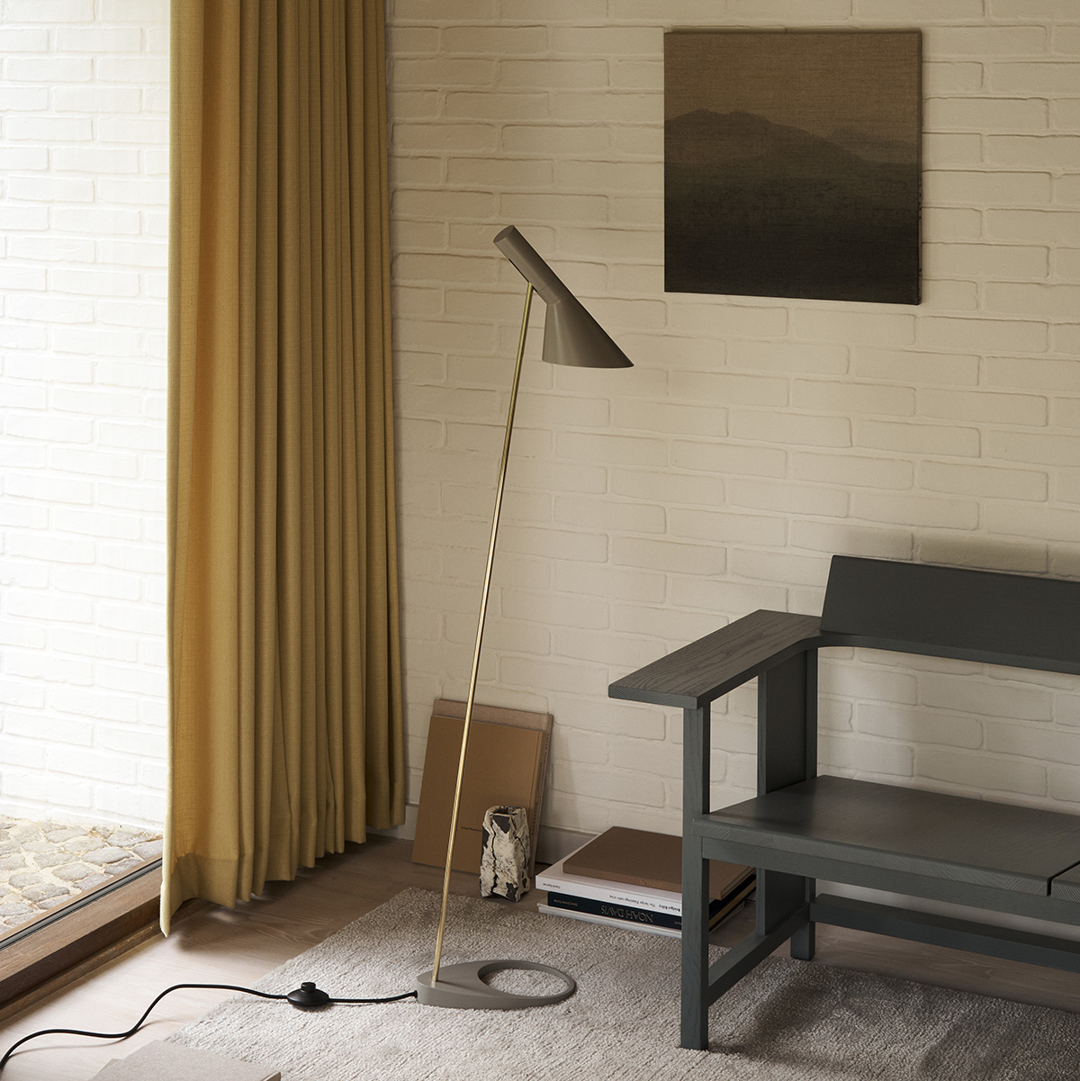 New editions of Arne Jacobsen classic lamp in black and warm grey by Louis Poulsen, featuring iconic Danish design elements