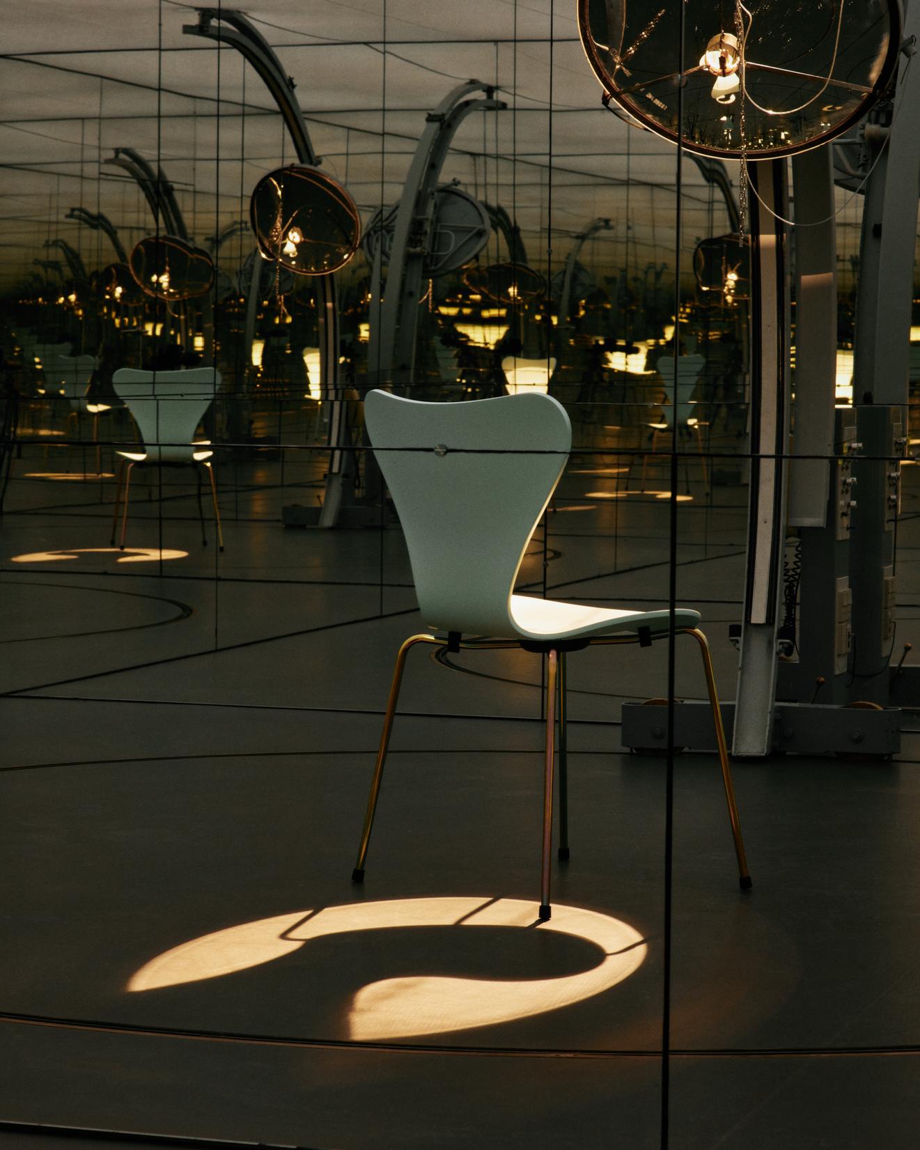 Fritz Hansen's limited edition Series 7 chair in beige with rainbow base styled in a contemporary Nordic dining area