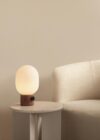 JWDA Table Lamp Large with red Verona travertine base and opal glass shade by Jonas Wagell for Audo Copenhagen