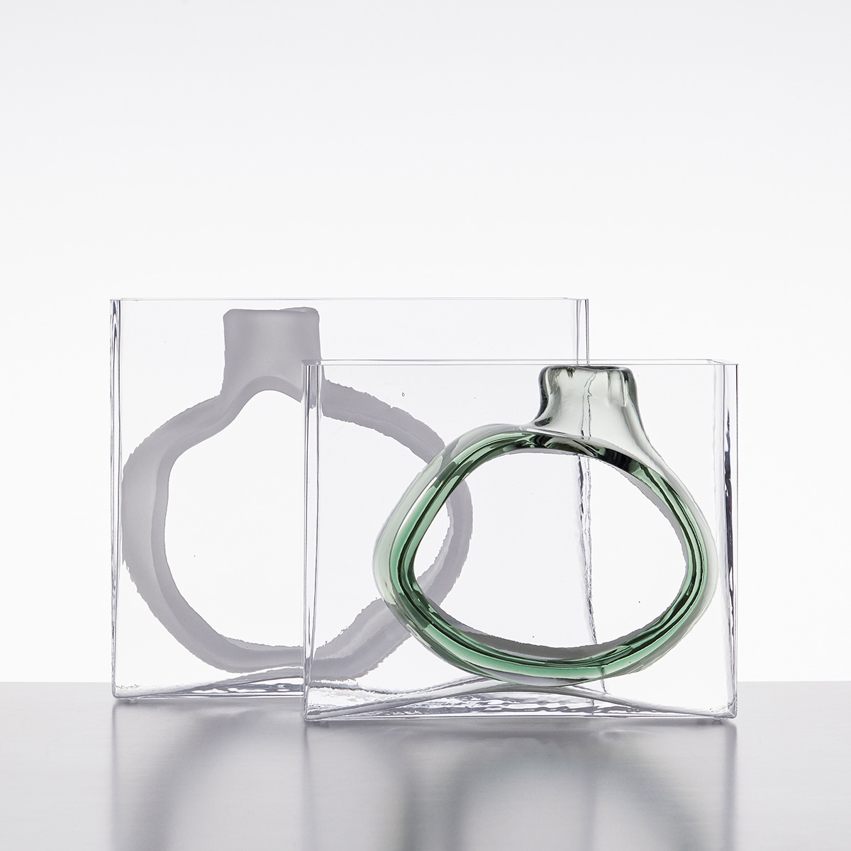 Swedish glass designer Matti Klenell portrait with his contemporary glass sculptures from 9 Factory Road series