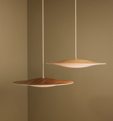 Sinus Wood pendant lamp by Piet Hein showcasing walnut finish and opal glass diffuser in modern interior