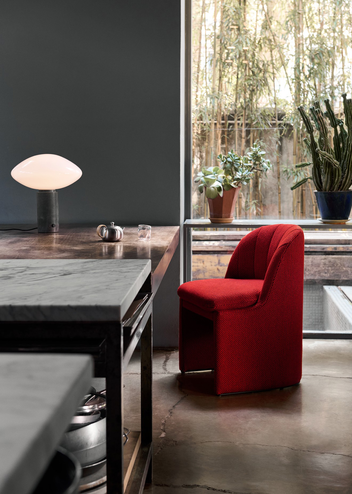 Side profile of Space Copenhagen Loafer Club chair highlighting graceful curves and plush cushioning