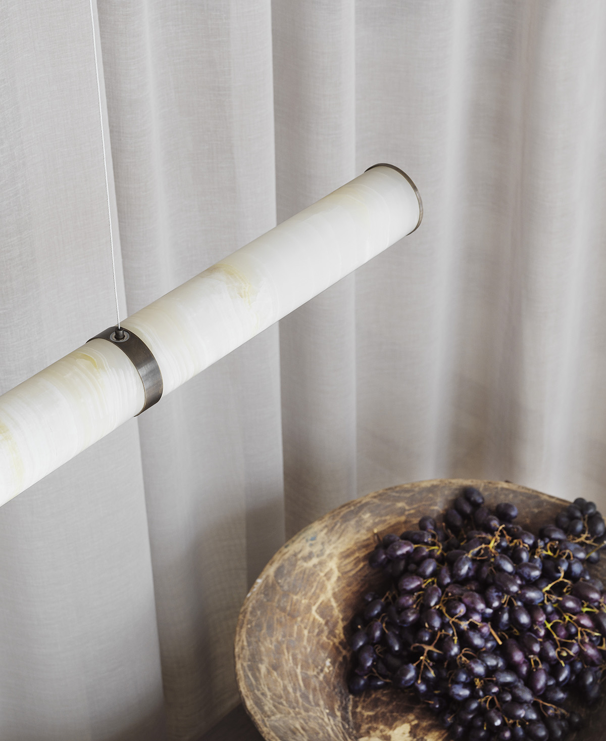 Close-up detail of natural onyx texture in PARS Collection showing stone's translucent qualities