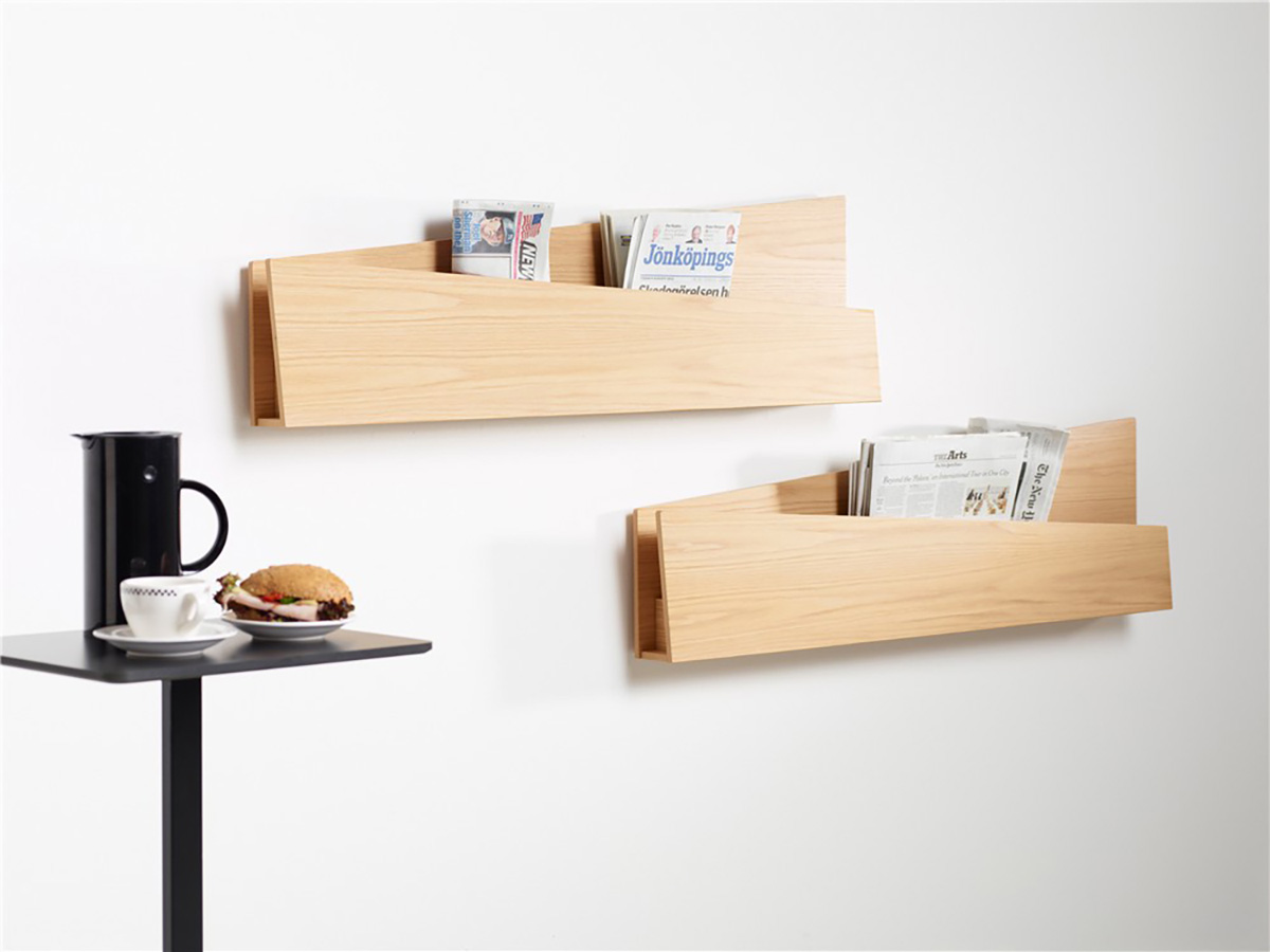 Louise Hederström Collar magazine storage system for Karl Andersson Söner featuring angled folded paper design