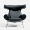 Hans J Wegner Ox Chair black leather Erik Jørgensen production showcasing sculptural design aesthetic