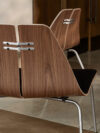 Poul Kjaerholm PK23 lounge chair in natural finish showcasing democratic design approach and accessibility