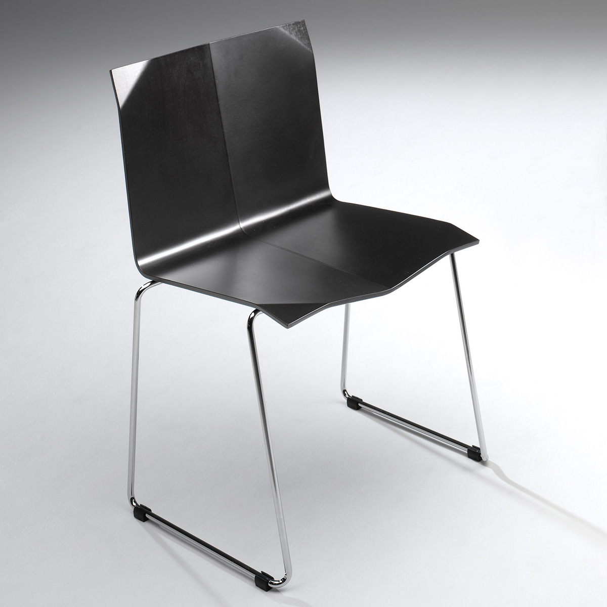 Chrome steel frame construction Origami chair industrial materials Sigurdur Gústafsson contemporary design