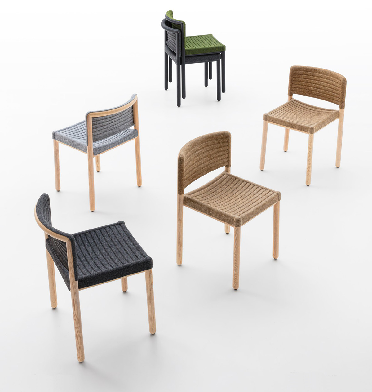 Multiple stackable STOL-N chairs by Boris Berlin demonstrating space-efficient storage for Crassevig
