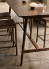 In Between bar and counter tables by Sami Kallio featuring bridge-inspired oak construction multiple heights