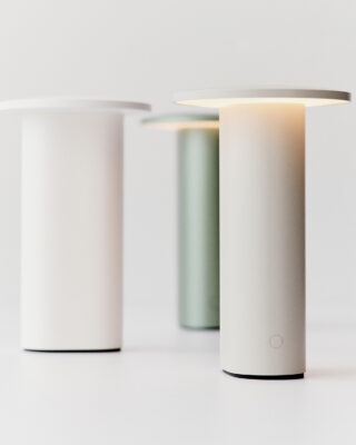 Solae portable lamp by Cecilie Manz for Fritz Hansen featuring oval aluminum base and circular LED top