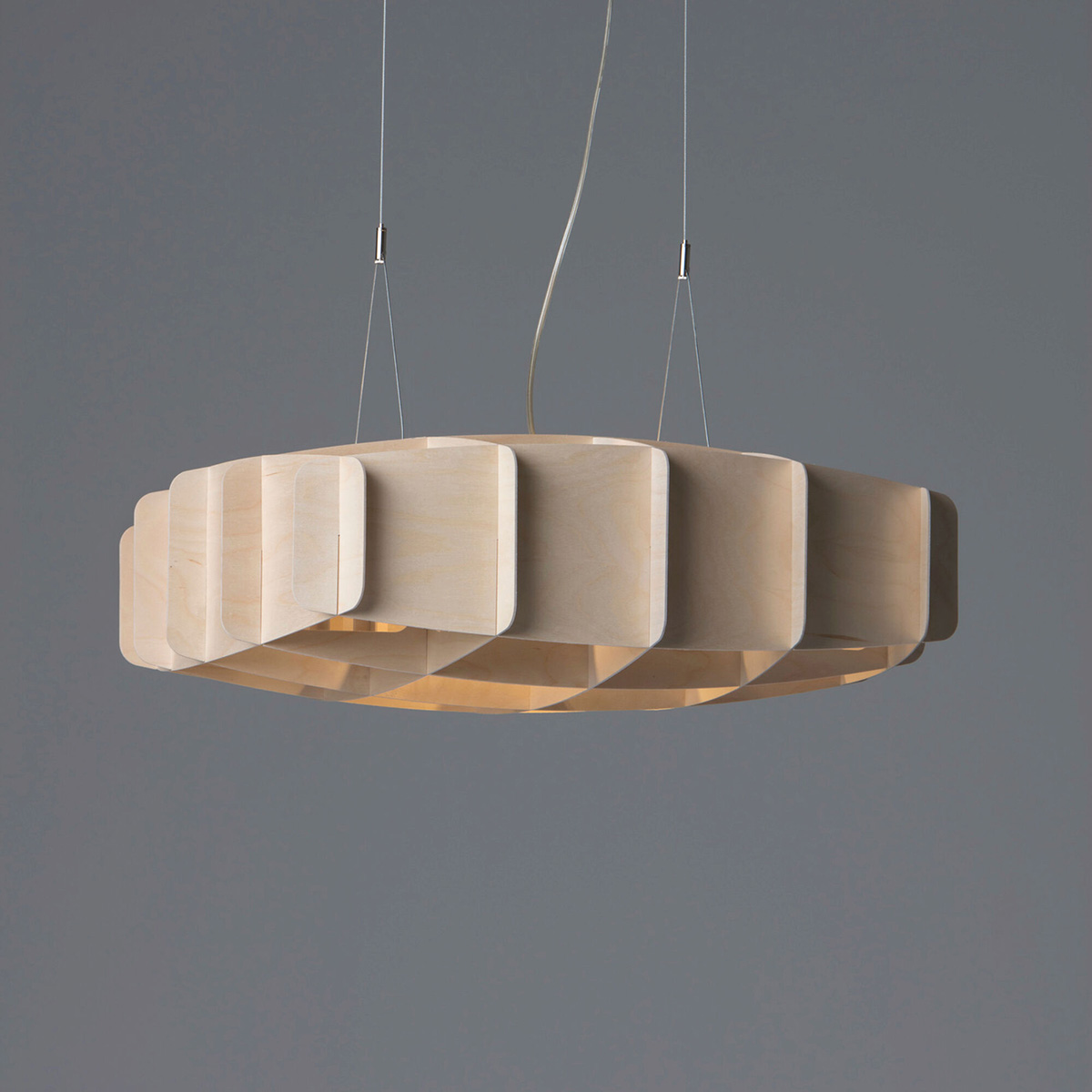 Harri Koskinen Ristikko pendant lamp collection by Pilke showing three geometric birch plywood sizes