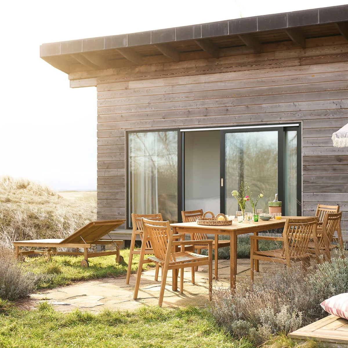 Thomas E Alken Sammen outdoor furniture collection by FDB Møbler showcasing teak tables chairs and benches